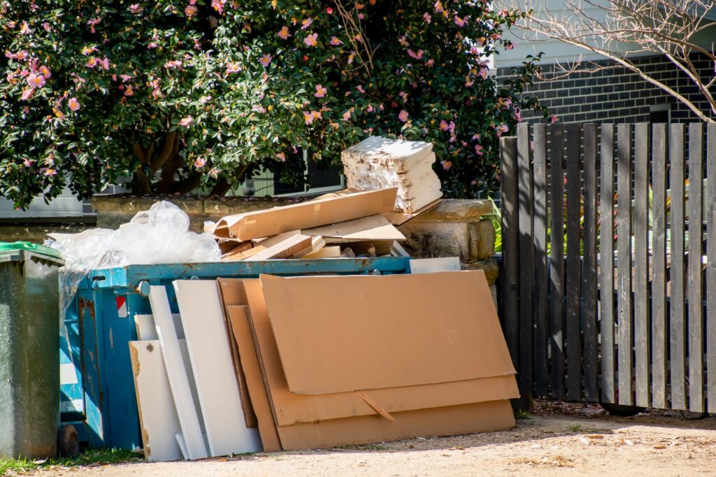 Bulk household rubbish garbage on the street waiting for council clean up waste collection.